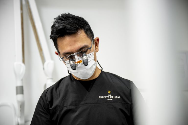 Dentist wearing specialist magnification glasses